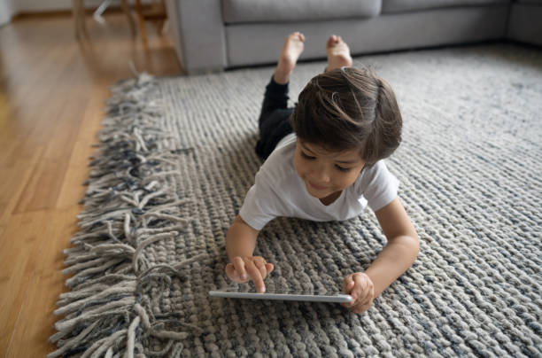 Girl lying on rug | J/K Carpet Center, Inc