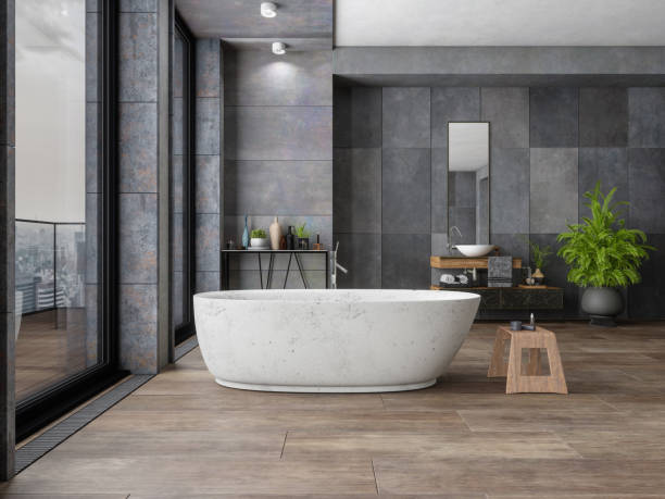 Bathroom tile dark flooring with bath tub | J/K Carpet Center, Inc